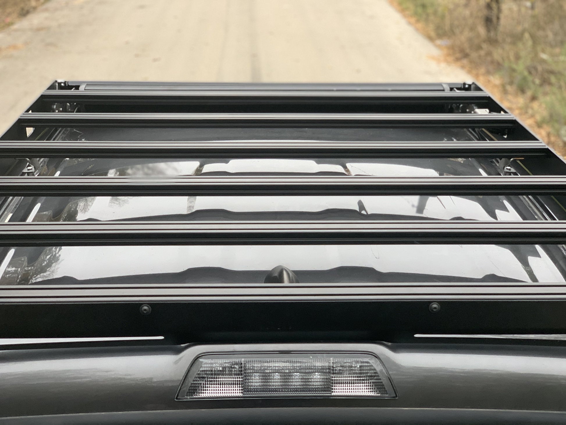 Top down rear view of gray Toyota Tacoma with Premium roof rack - Cali Raised LED